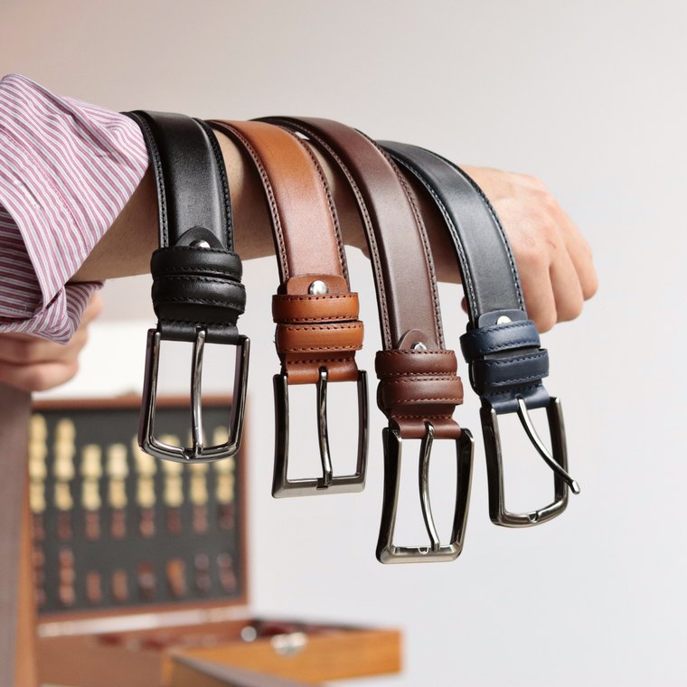 Leather belts in black, tan, navy and brown